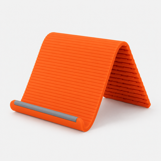 FikMark flexible silicone phone and tablet stand in orange, bent into a stand
